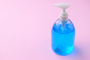 clean alcohol gel bottle sanitizer medical on pink background