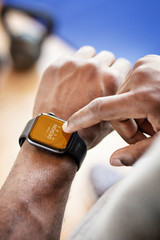 Fit man using a smartwatch