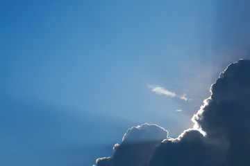 sun light shine through cloud on clear blue sky background