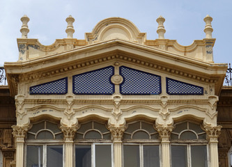 Fototapeta na wymiar Detail of enclosed balcony. Revival building in the city center of Almeria. Spain. 