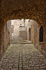 A small road between the old houses of Buonalbergo, a village in the province of Benevento