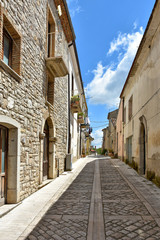 Fototapeta na wymiar A small road between the old houses of Buonalbergo, a village in the province of Benevento
