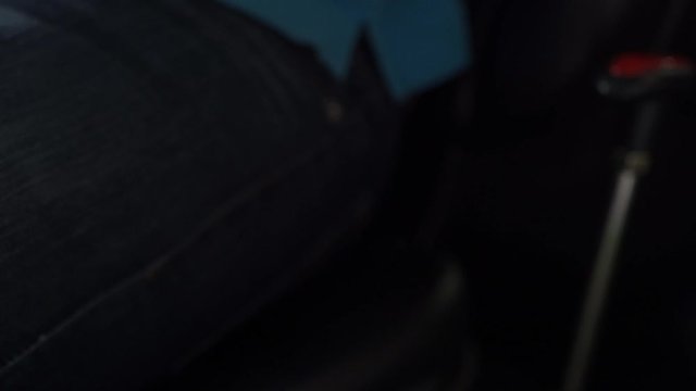 Agriculture. Agricultural vehicle. Gear shift mechanism in the cabin of the tractor with a cab. Classical The first transfer. A man sits on a chair in a car. Mini tractor for cottage, domestic needs