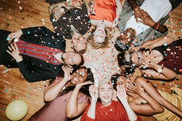 Friends celebrating on the floor
