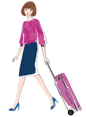 ピンクのスーツケースを運ぶ女性