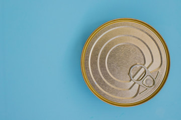 Canned goods on a blue background.Food storage.Food for donations.Food aid.Food delivery.