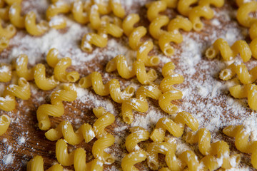 A lot of pasta scattered on the table