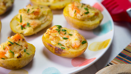 Stuffed potatoes with  vegetables and cheese