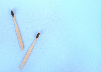 zero waste concept. bamboo toothbrushes on a white-blue background
