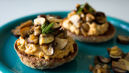 Vegan toast with hummus and mushrooms