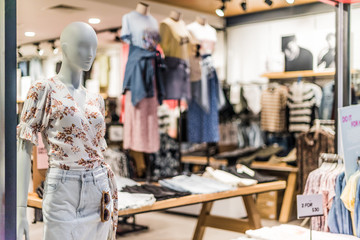 Fashion store with mannequins showing feminine clothing