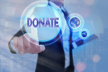 Writing note showing Donate. Business concept for give money or goods for good cause for example to...