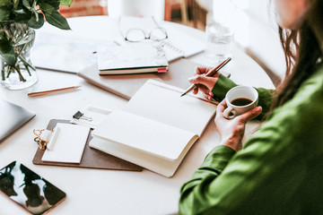 Woman writing in a journal