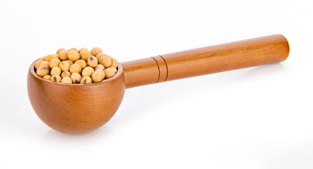 soy bean in wooden scoop on white background