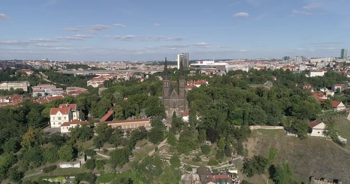 Vysehrad Castle, Slavin graveyard, The Basilica of St. Peter and St. Paul in Prague, the Czech republic. Drone shot, D-cinelike, Descending and tilting up.