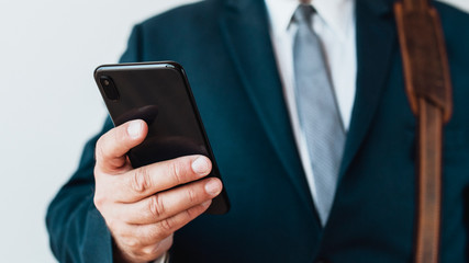 Businessman checking his phone