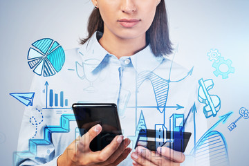 Hands of woman shopping online with phone
