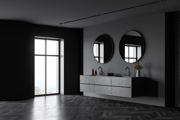Double sink in dark grey bathroom corner