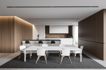 White and wooden kitchen with bar and table