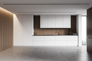 White and wooden kitchen interior with countertops