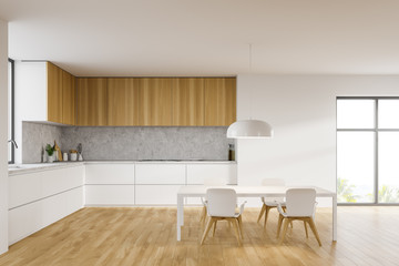 Fototapeta na wymiar Table and countertops in white kitchen