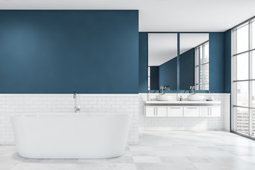 Fototapeta na wymiar White and blue bathroom, tub and sink