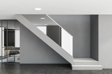 Stairs in gray living room interior