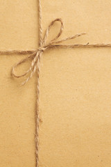 String bow on brown paper