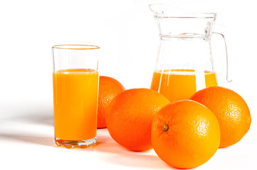 glass of fresh orange juice with fresh fruits on white background