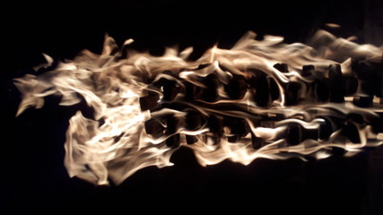 Fire with flames on a black background close up