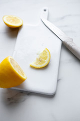 sliced lemon on a white ceramic board