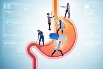 Doctors examining stomach in medical concept