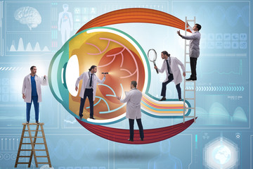 Doctor examining giant eye in medical concept