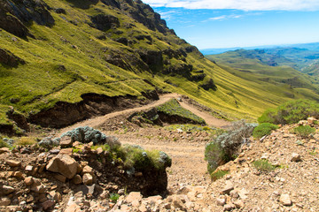 Fototapeta na wymiar The famous Sani mountain pass dirt road with many tight curves connecting Lesotho and South Africa