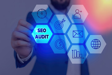 Writing note showing Seo Audit. Business concept for Search Engine Optimization validating and...