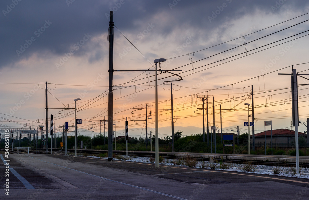 Wall mural train station at sunset in italy