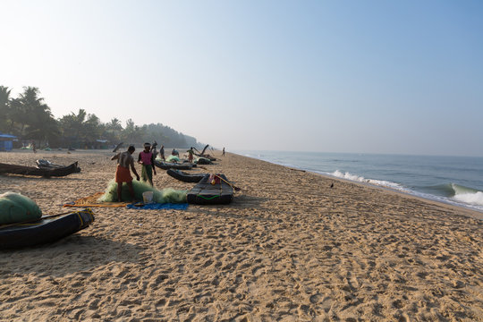 Mararikulam, Kerala - January 6, 2019: Fishermen preparing nets on the beach in Marari Beach in Mararikulam kerala india
