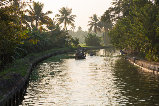 Alleppey, Kerala - January 6, 2019: boats in a canal in alleppey backwaters kerala india
