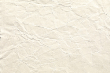 Crumpled old pale brown paper background texture