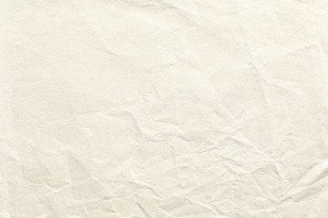 Crumpled old pale brown paper background texture