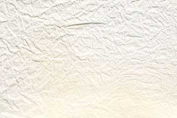 Crumpled old pale brown paper background texture