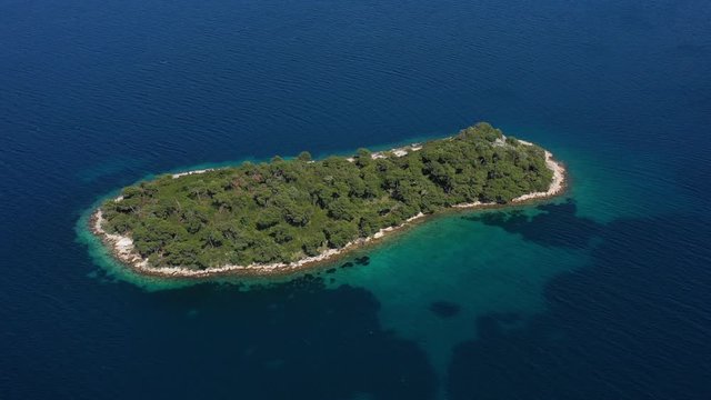 Beautiful Island Rutnjak in Adriatic Sea surrounded witw Blue and Tirkiz Sea - Aerial Drone View