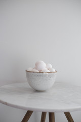 Rustic bowl of raw chicken eggs. Easter minimalism concept