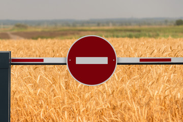 A barrier with a prohibition sign. A symbol of the crisis in agriculture industry