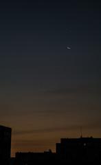 Moon and Venus over the city