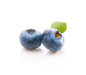 Two blueberries with leafe on white background. Isolated