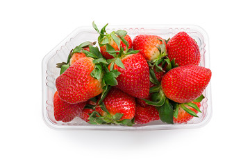 Strawberries in plastic box top view. Isolates