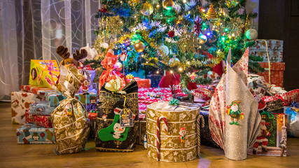 Christmas, lots of nicely wrapped presents under the home Christmas tree.