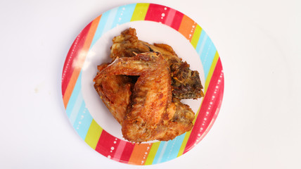 tasty grilled chicken wings isolated on white background.