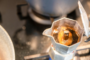 Moka coffee maker with hot coffee inside